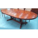 DINING TABLE, rosewood, oval, extending on column supports with triform bases, 275cm L.