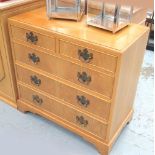 CHEST OF DRAWERS, in oak with two short and three long drawers on bracket support,