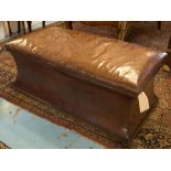 OTTOMAN, Victorian nut brown leather with padded rising seat and waisted sides on bun supports,