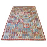 AFGHAN KILIM, 304cm x 206cm, of repeat polychrome panels with various medallions and crest border.