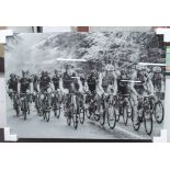 PHOTOGRAPH ON TEMPERED GLASS, in black and white of a road cycle race, 80cm x 120cm.