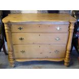 COMMODE, 19th century Continental pine, shaped top over three graduated drawers and columns,