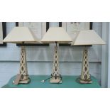 TABLE LAMPS, three, wooden obelix design, each 70cm H overall including shades.