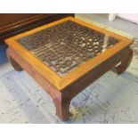 CHINESE LOW TABLE, elm with a square glass top and lattice decoration, 47cm H x 108cm square.