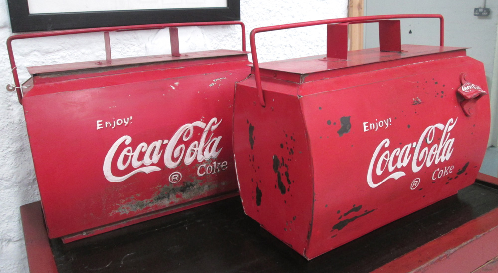 ICE COOLERS, a pair, red painted metal, with 'Coca Cola' label to side, 44cm x 23cm x 37cm H.