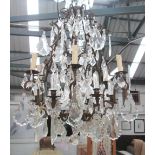 CHANDELIER, six branch on a metal frame with glass drops, 104cm H plus chain.