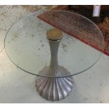 LOW TABLE, with a circular glass top on a trumpet shaped pedestal base, 58cm diam. x 57cm H.