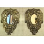 WALL SCONCES, a pair, 19th century repoussé silvered brass, oval bevelled mirror,