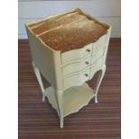 BEDSIDE TABLE CHEST, Continental with a red marble top over three painted shaped drawers,