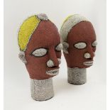 IFE BEADED HEADS, a companion pair, white/red/yellow beads, each 40cm H.