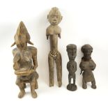 TRIBAL FIGURES, four various, including a seated maternity figure, carved wood, tallest 67cm H.