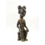BAULE SEATED FEMALE SPOUSE FIGURE, carved wood with beaded ornament, 50cm H.