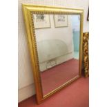 WALL MIRROR, with bevelled rectangular plate and gilt frame, 141cm H x 110cm W overall.