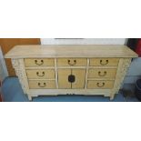 CHINESE SIDEBOARD, with seven drawers and a cupboard, in a distressed effect, cream painted finish,