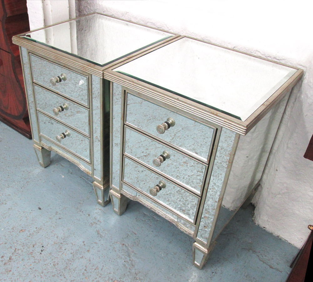 MIRRORED SIDE CHESTS, a pair, with three drawers below, on square supports, 50cm x 45cm x 67cm H.