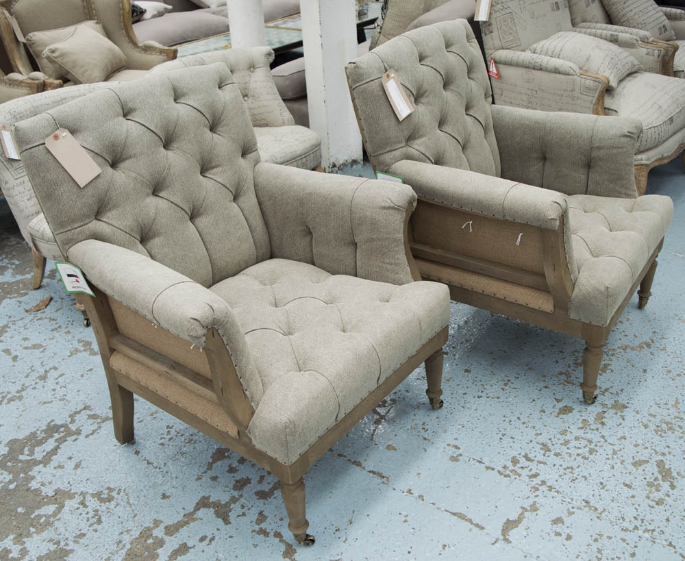 ARMCHAIRS, a pair, button back, with open back on front castors, 80cm W.