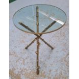 OCCASIONAL TABLE, the circular glass top on a triform base on gilt metal, in the form of branches,