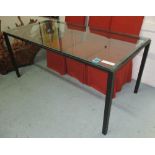 GLASS TABLE/DESK, by Tom Faulkner, with metal frame, 77cm H x 85cm W x 170cm L.