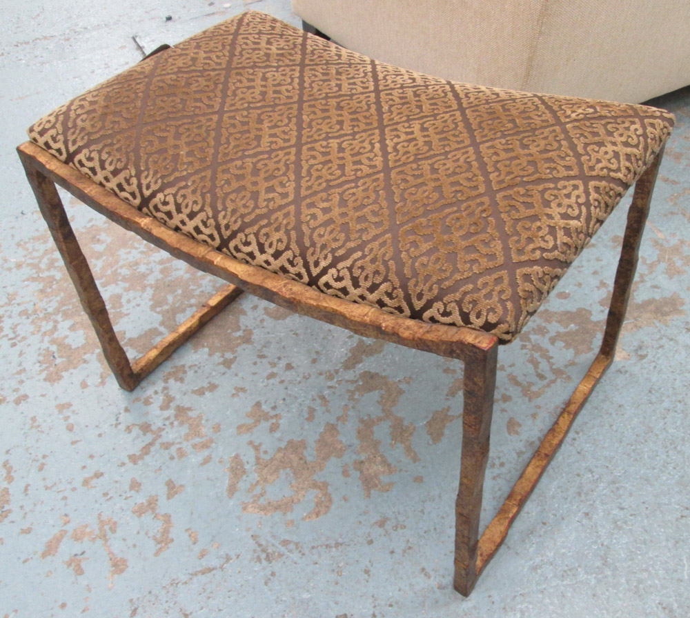 FOOTSTOOL, with a geometric gold and brown fabric on distressed gilded frame, 62cm x 40cm x 42cm H.