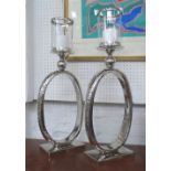TABLE CANDLE LIGHTS, a pair, Contemporary design, plated metal stands, glass funnel tops,