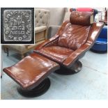 LOUNGE CHAIR AND STOOL, tan stitched leather, black framed on circular base with conforming stool.