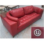 NATUZZI SOFA, with red leather upholstery, 232cm L x 103cm D.