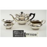 SILVER THREE PIECE TEA SET, early 20th century, teapot with ebonised wooden handle,