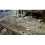 WINE RACKS, a set of six, in lucite, 37cm H.