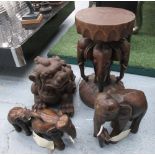 CARVED TEAK ELEPHANTS, a collection of three groups, largest 52cm H x 30cm diam., plus a dog of Fu.