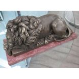 RECUMBENT LIONS, a pair, in bronze on marble bases, 32cm L.