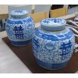 GINGER JARS, a pair, Chinese style in blue and white, 23cm H.