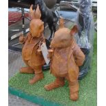 CAST IRON FIGURINES, 'Mr Rabbit and Mr Ratty', in a rusty finish, 45cm x 40cm.