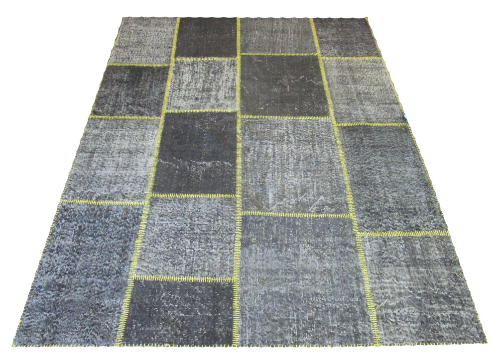 PATCHWORK RUG BY VENTIQUE, 244cm x 177cm, en gris tiled designs with yellow stitching.