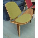 EASY CHAIR, in the style of the Shell chair by Hans J. Wegner, with a sap green upholstery.