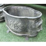PLANTERS, a pair, in an oxidised metal finish with lions head motifs and claw feet,