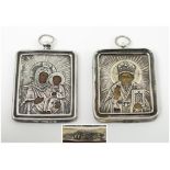 RUSSIAN TRAVELLING ICONS, two similar, both silver clad, each 3.75cm H x 3.25cm W.