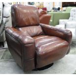REVOLVING EASY CHAIR, tan leather upholstered revolving on a stand.