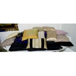 CUSHIONS, approx twenty five, a large quantity, many black, some coloured and patterned.