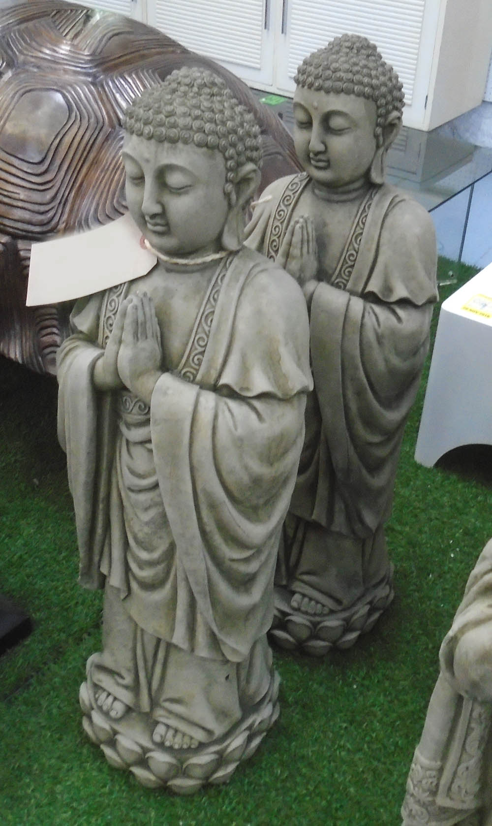 PRAYING BUDDHAS, a pair, reconstituted stone, 75cm H.