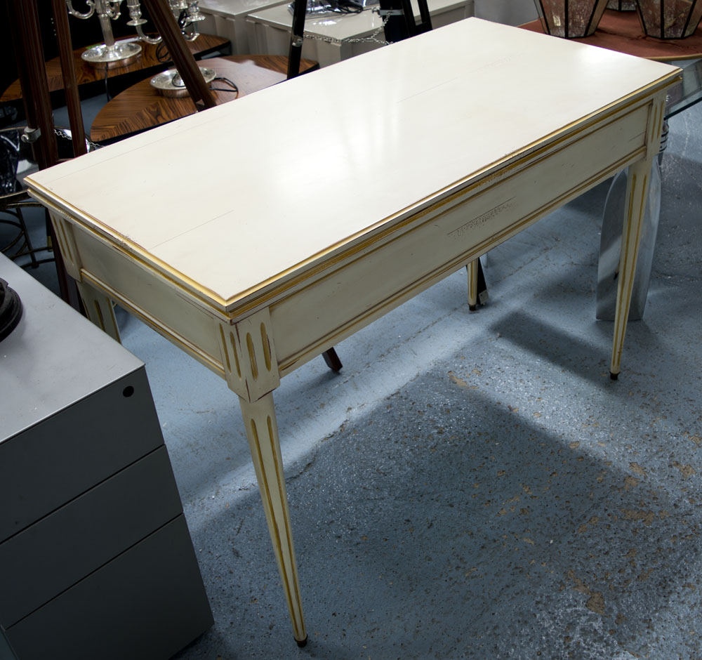 TEA TABLE, by Grange in an ivory distressed finish with gilt details on tapering fluted supports,
