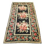 KARABAH RUG, 245cm x 130cm, repeat rose bouquets on a noir field within corresponding borders.