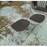 DINING CHAIRS, a set of eight in the Bertoia style with black seating pads on a wire frame,