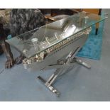 'TITANIC' CONSOLE TABLE, with glass top on chromed base in the form of an ocean liner,