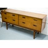 CHEST, 1970's teak with four long drawers, 72cm H x 213cm W x 46cm D.