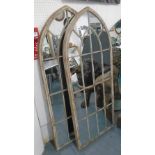 MIRRORS, a pair, architectural gothic style in metal frames with a painted distressed effect,