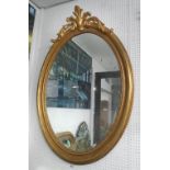 MIRROR, Louis XV style, bevelled plate in a gilded oval frame, 130cm x 85cm.