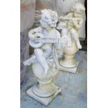 GARDEN STATUES, two, reconstructed stone of musical cherubs each sitting on an urn, 100cm H.