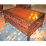 LOW TABLE, with three faux book spine drawers to each side and brass handles to the ends,