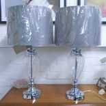 TABLE LAMPS, a pair, glass lobed stem on chromed metal mounts with shades, 70cm H.