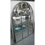 ARCHITECTURAL MIRROR, with domed top in a metal frame, 150cm x 101cm.